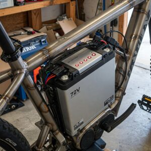 Image showing the installation process of a 72v ebike battery into an electric bike frame