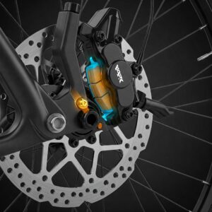 "Image highlighting the location of the e bike brake pads within the brake caliper on a bicycle wheel."