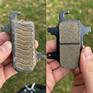 "Visual comparison showing a worn-out e bike brake pads alongside a brand new one, indicating the need for replacement."