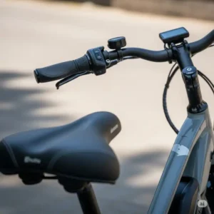 Detail of ergonomic handlebars and a wide, comfortable seat on an electric bike, designed for maximum comfort during rides, especially beneficial for seniors. A crucial aspect of the best electric bike for seniors.