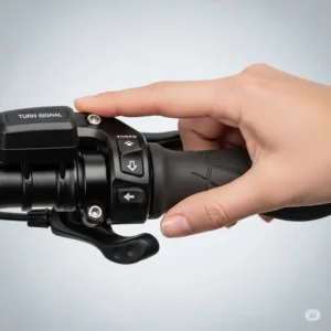 A hand clearly shown activating the switch for the ebike turn signals on the handlebar, demonstrating ease of use.