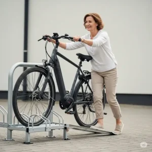 A person effortlessly pushing a heavy ebike up the integrated ramp onto an ebike rack with ramp, emphasizing the ease of use and reduced physical strain provided by the ramp design.