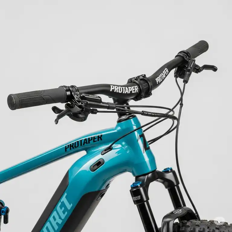 Protaper ebike handlebars on a high-performance electric mountain bike, showcasing ergonomic design and control.