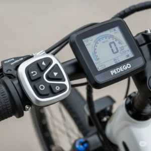 Detailed shot of the intuitive digital display and handlebar controls on a Pedego electric bike, providing easy access to ride data and settings.