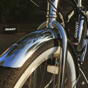The chrome fender and whitewall tires of a Giant cruiser bike.
