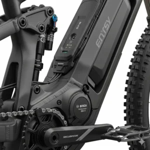 A detailed view of the integrated motor and battery pack on a modern full suspension electric mountain bike.