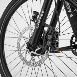  A close-up of the responsive hydraulic disc brakes on the front wheel of the Lafree electric bike.