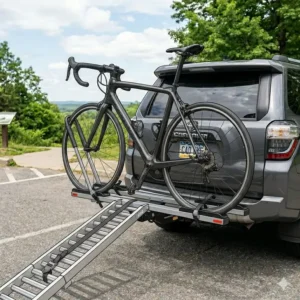 The compact and stowed position of a folded hitch bike rack with ramp for road bikes.